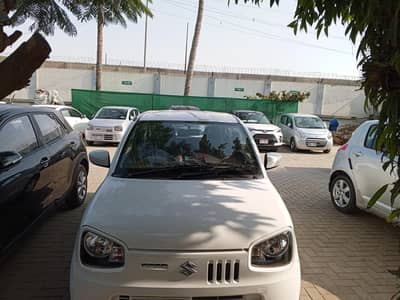 Suzuki Alto VXL AGS 2024 white, excellent condition.