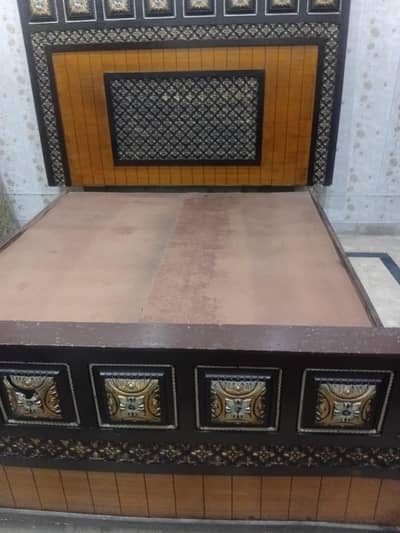 Wooden bed without mattress