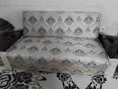 brown wooden sofa of soft spring foam