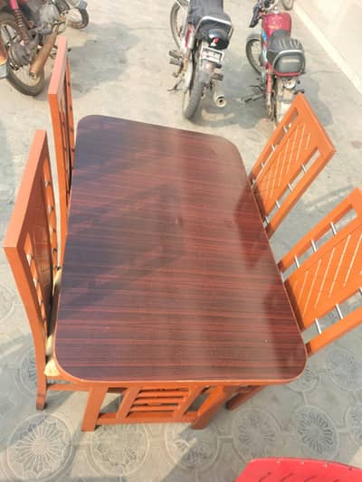 wooden dining table set with chairs in mahogany