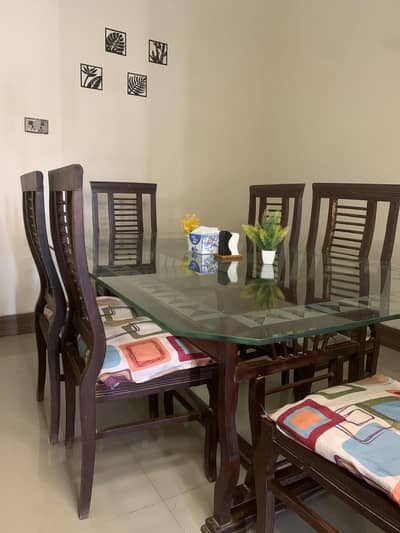 Dining Table with Six Chairs , Glass Top and Wooden Frame
