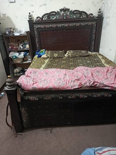 beautiful bed and dressing table and cabinet