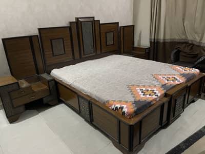King bed with two side tables and dressing