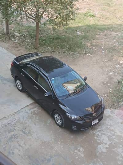 Corolla Nov 2011 Black in Dr home used car. Well maintained.