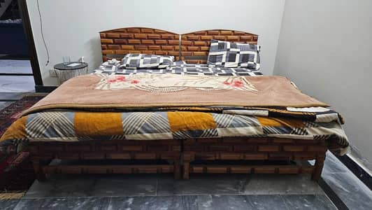 2 wooden beds