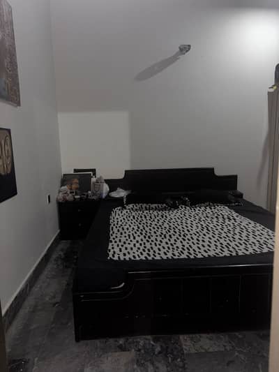 Bed with dressing and side table