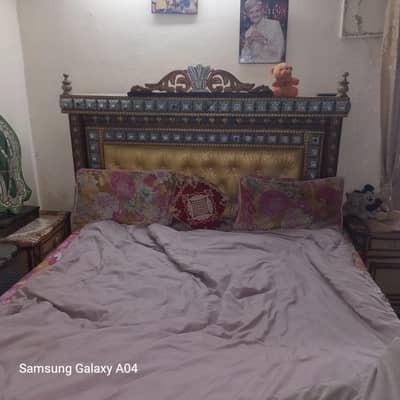 double bed and dressing with two side tables and dressing showcase