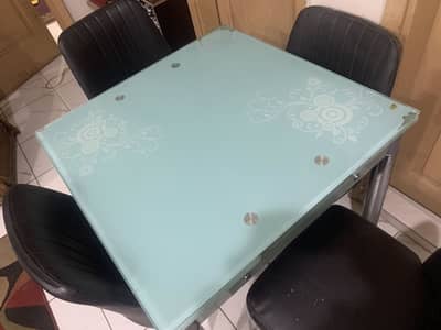 Glass dining table with chairs