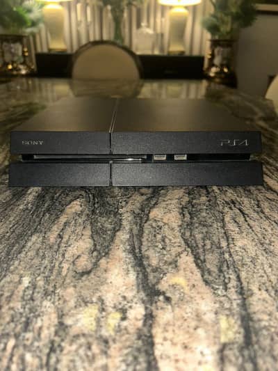 Playstation 4(used condition) 1 original controller and 2 games