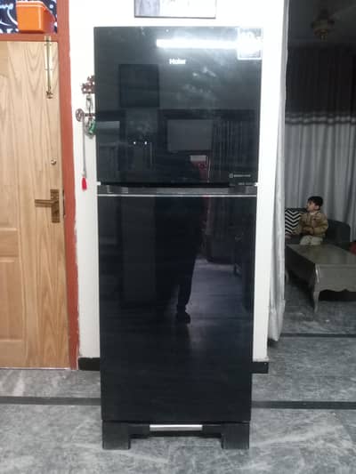 Haier large size black glass door refrigerator rarely used.