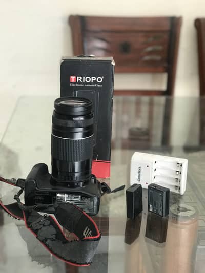 Cannon cramers 1300D with lens 75-300-with flashlight two better