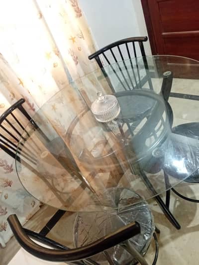 wood dining table with iron chairs