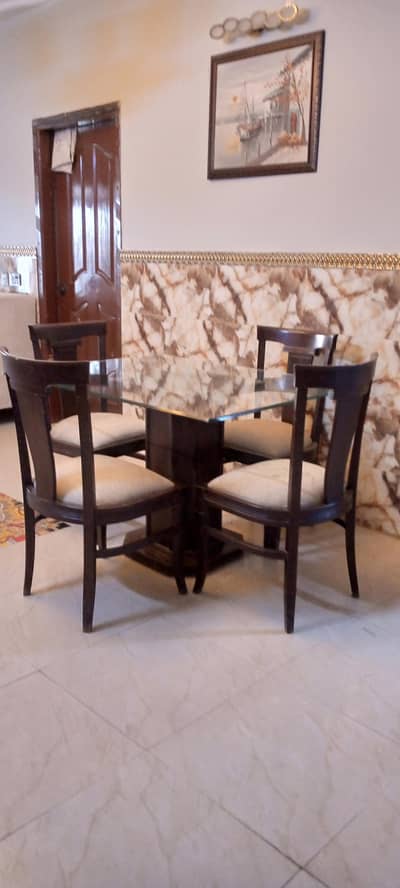 wooden dining table with glass top