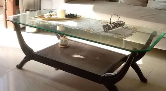 wooden center table with glass top