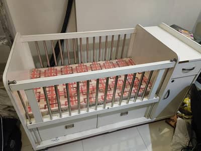 kids wooden cot with three drawers and one wardrobe