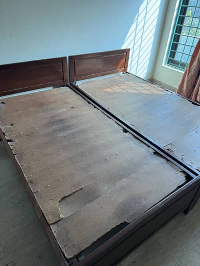 2 solid wood single beds in great condition