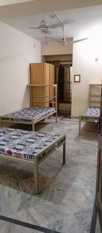 Boys hostel building for sale in H-13 Sector near NUST. 7 stories + basement on 7 marla + 5 marla extra land. 5 mins drive / 15 mins walking distance from NUST. Ideal investment with high rental potential. Contact for details. +923158147212