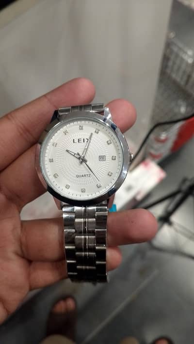 sliver watch with white dial