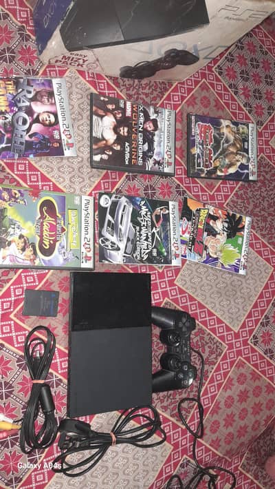 play station 2 with controller and CD