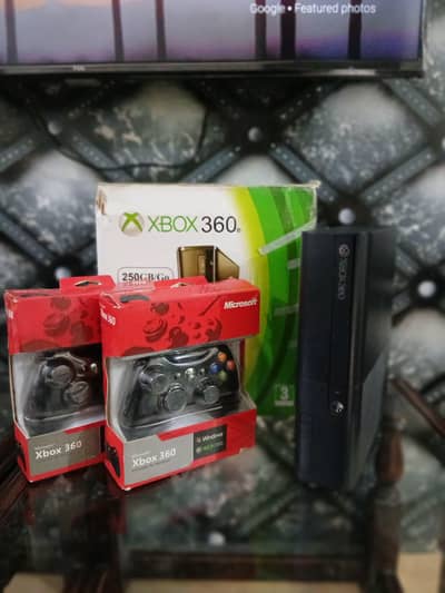 x box 360e slim with two controllers
