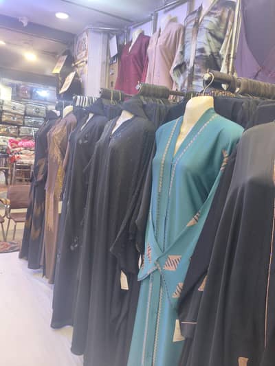 abaya shop helper