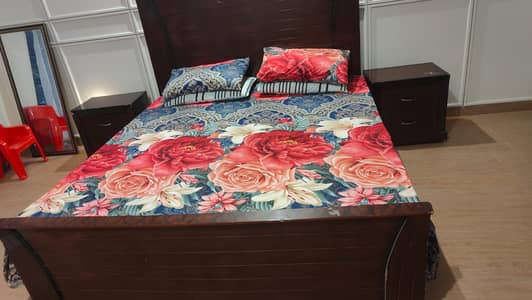 Bed with two side tables