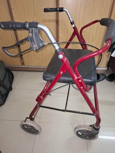 Rollator walker with seat and brakes