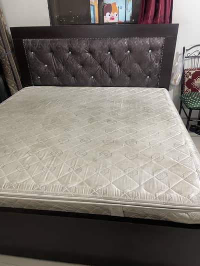 Double bed with spring mattress