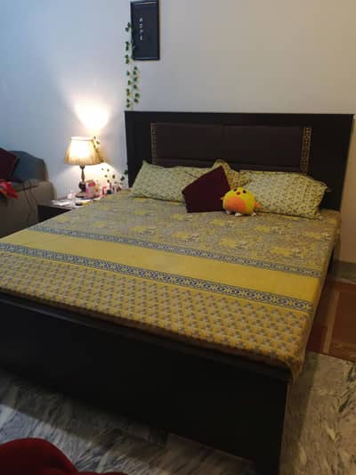 brown bed with mattress