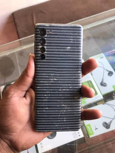 Motorola Edge XT2063-2 is a 2020 mid-range 5G smartphone