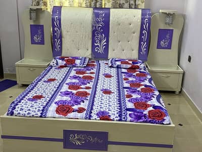 A full bed set with 2 site tables and 3 door wordrop and dressingtable