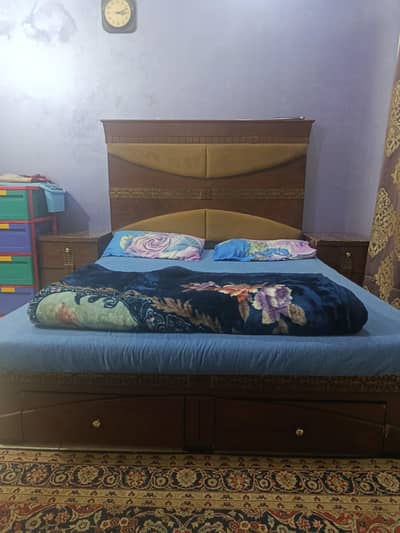 bed with 2 large storage drawers on front