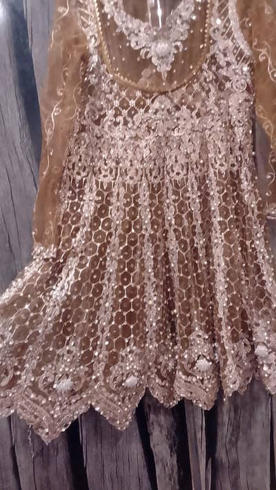 heavy embroided short shirt with bell bottom trouser and net duppata