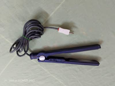Used Iron nd curler. . . .