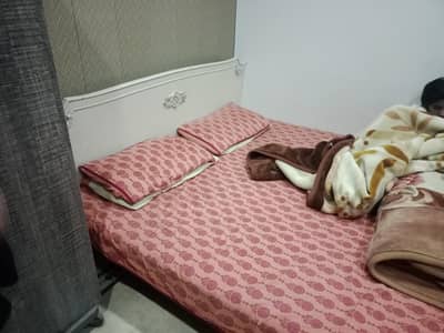 double bed with mattres and table