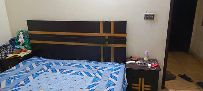 king bed with side table and dressing