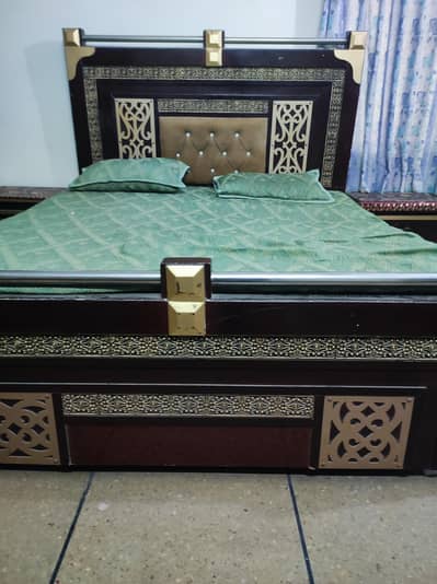 wooden bed and dressing table