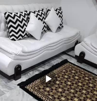 White leather sofa with cushions