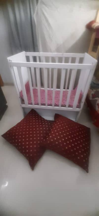 wooden baby cot with 2 full size cushions