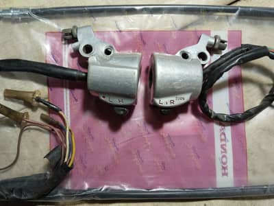GRIP ASSEMBLY GENUINE CG125 2005 MODEL