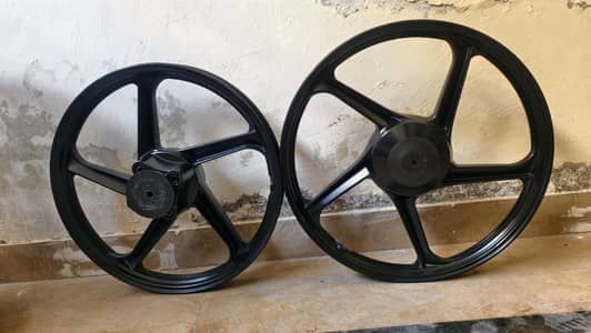 125 ALLOY RIMS WITH PLATES