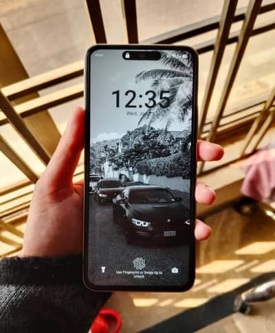 Itel s25 with book case and earbuds