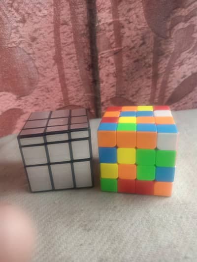 2 rubic cubs mirror cube and a 4x4 rubic cube