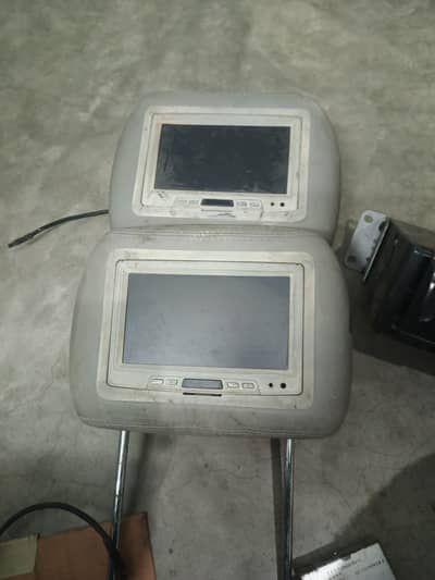 Car back‑seat LCD screens with DVD changer/player