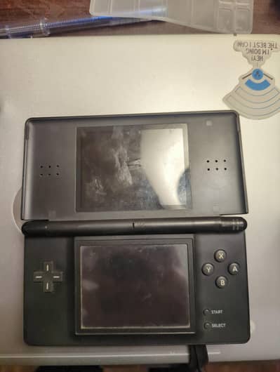 Nintendo DS lite with charger and Game ( Non functional )