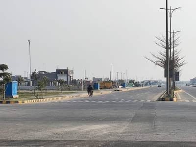 5-Marla Residential Plot in DHA Phase 9-Town Block D Wide Space for Dream Landscaping, Verified Ownership, Underground Utilities Planned, Price Only 105-Lac Golden Opportunity for Builders & Investors by Buttar Estate & Groups