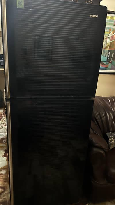 orient glass door fridge in black color for sell in good condition