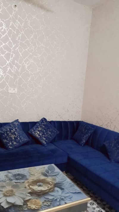 A royal‑blue velvet sofa  / L SHAPED