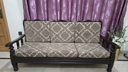 5-Seater wooden sofa with patterned fabric cushions. V. Good Condition
