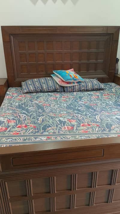 wooden bed without mattress with both of sidetables